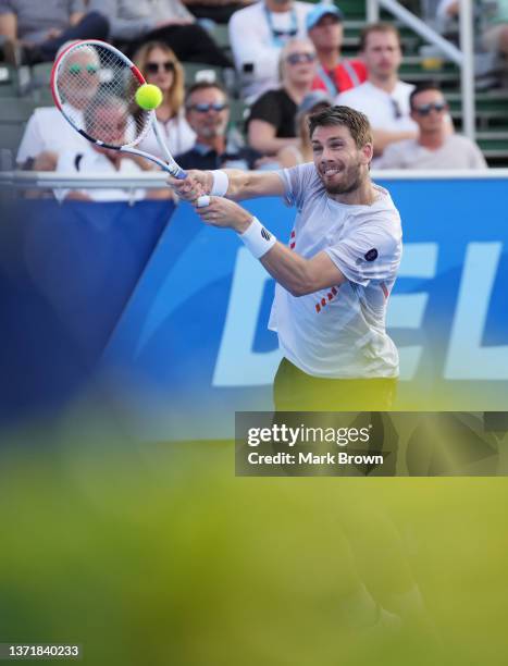 Cameron Norrie of Great Britain returns a shot against Reilly Opelka of the United States during the Finals of the Delray Beach Open by Vitacost.com...