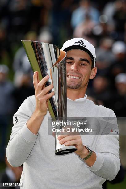 Joaquín Niemann of Chile celebrates with the trophy during the trophy ceremony after winning during the final round of The Genesis Invitational at...