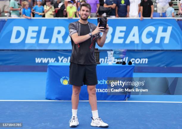 Cameron Norrie poses with his trophy after winning against Reilly Opelka of the United States in the Finals of the Delray Beach Open by Vitacost.com...