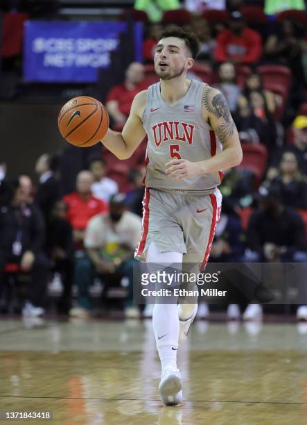 Jordan McCabe of the UNLV Rebels brings the ball up the court against the Colorado State Rams during their game at the Thomas & Mack Center on...