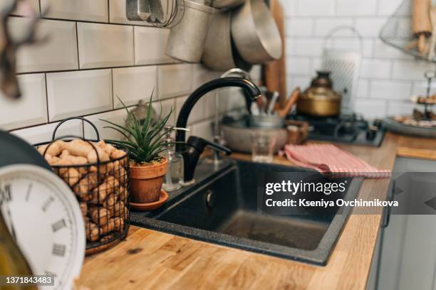 modern kitchen with black sink and fronts - diskho bildbanksfoton och bilder