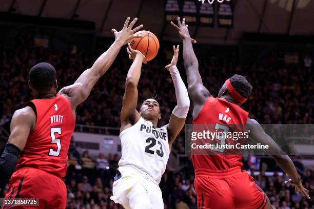 Jaden Ivey of the Purdue Boilermakers shoots against Aundre Hyatt and Mawot Mag of the Rutgers Scarlet Knights at Mackey Arena on February 20, 2022...