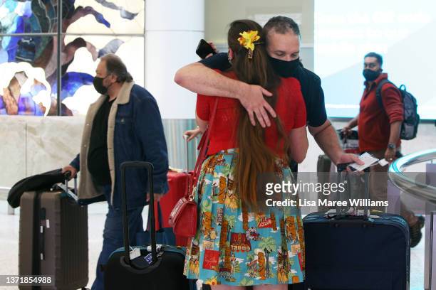 Loved ones embrace on arrival at Sydney Airport on February 21, 2022 in Sydney, Australia. Australia is welcoming fully-vaccinated international...