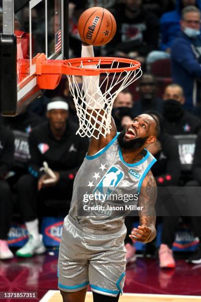 LeBron James of Team LeBron dunks the ball in the first half during the 2022 NBA All-Star Game at Rocket Mortgage Fieldhouse on February 20, 2022 in...