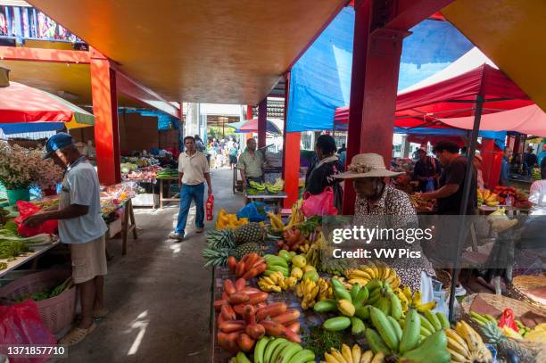 Locals shopping at the farmers' market in town. Victoria, Mahe Island, The Republic of the Seychelles..