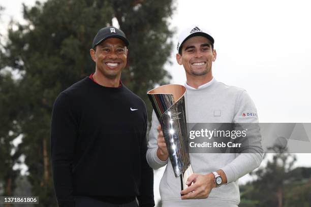 Joaquín Niemann of Chile celebrates with the trophy alongside tournament host Tiger Woods after winning during the final round of The Genesis...