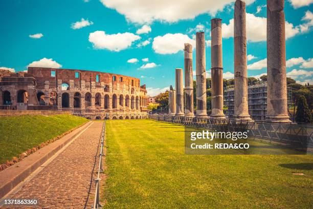 Roman roads upon the Palatine Hill with beautiful view on Coliseum in background. Rome. Lazio. Italy. Europe.