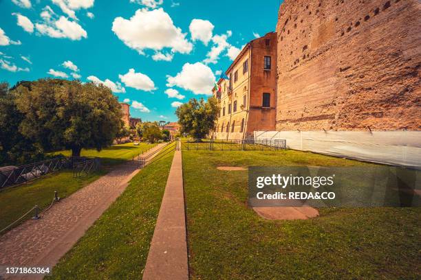 Roman roads upon the Palatine Hill with beautiful view on Coliseum in background. Rome. Lazio. Italy. Europe.