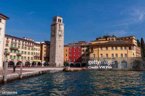 The Apponale Tower, in the Piazza 3 Novembre, on the shores of Lago di Garda. Riva del Garda, Lago di Garda, Trentino Alto Adige, Italy..