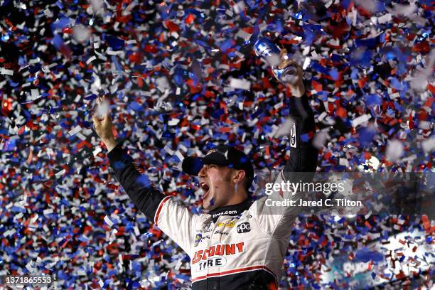 Austin Cindric, driver of the Discount Tire Ford, celebrates in the Ruoff Mortgage victory lane after winning the NASCAR Cup Series 64th Annual...