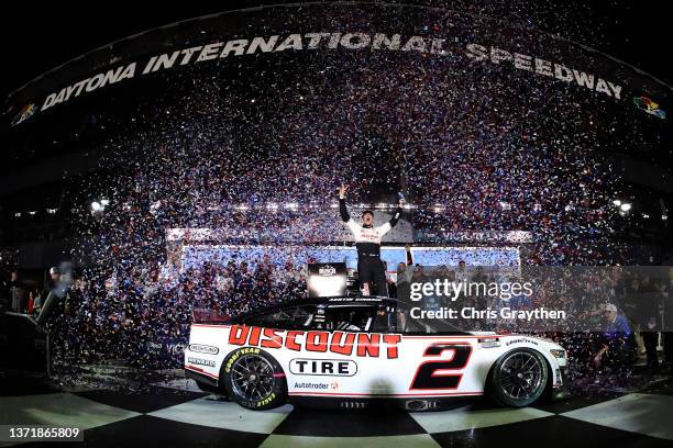 Austin Cindric, driver of the Discount Tire Ford, celebrates in the Ruoff Mortgage victory lane after winning the NASCAR Cup Series 64th Annual...