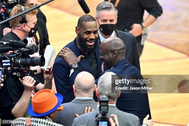 Michael Jordan and LeBron James hug after the presentation of the NBA 75th Anniversary Team during the 2022 NBA All-Star Game at Rocket Mortgage...