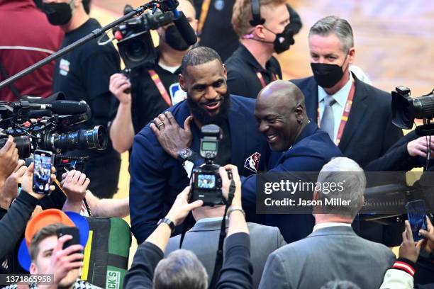 Michael Jordan and LeBron James hug after the presentation of the NBA 75th Anniversary Team during the 2022 NBA All-Star Game at Rocket Mortgage...