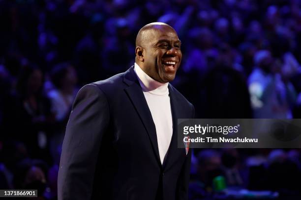 Earvin "Magic" Johnson reacts after being introduced as part of the NBA 75th Anniversary Team during the 2022 NBA All-Star Game at Rocket Mortgage...