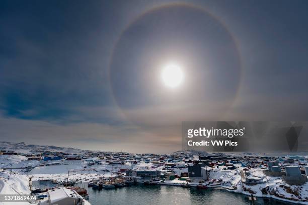 Solar halo, an phenomenon caused by light interacting with ice crystals in the atmosphere. Ilulissat, Greenland..
