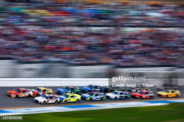 Bubba Wallace, driver of the McDonald's Toyota, and Austin Cindric, driver of the Discount Tire Ford, lead the field during the NASCAR Cup Series...