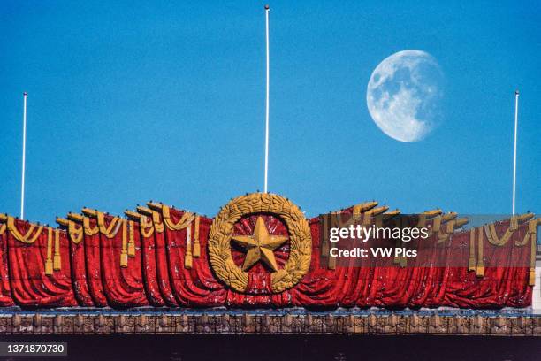 Detail of the Communist symbols over the entrance to the National Museum of China with the moon..