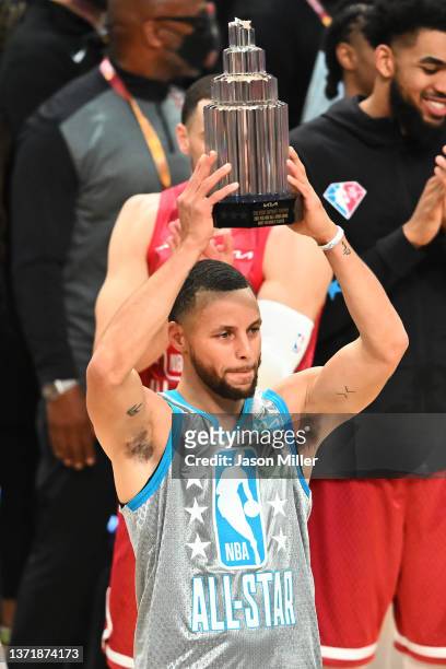 Stephen Curry of Team LeBron holds the Kobe Bryant Trophy after being named MVP during the 2022 NBA All-Star Game at Rocket Mortgage Fieldhouse on...