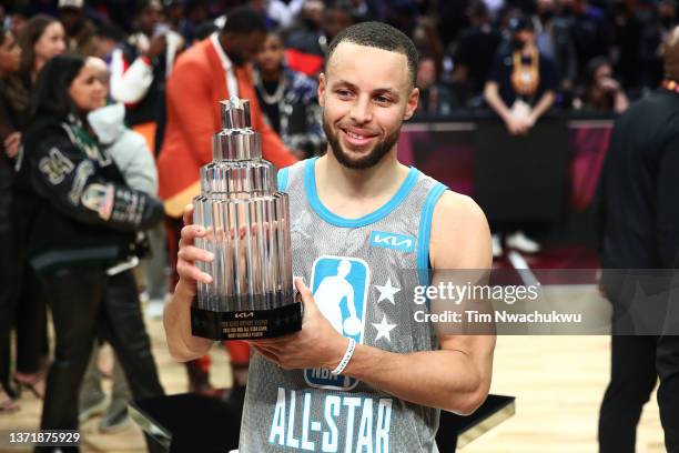 Stephen Curry of Team LeBron holds the Kobe Bryant Trophy after being named MVP during the 2022 NBA All-Star Game at Rocket Mortgage Fieldhouse on...