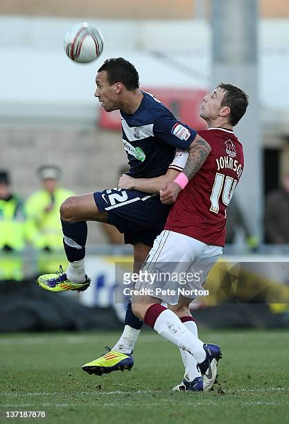 Liam Dickinson of Southend United attempts to head the ball under pressure from John Johnson of Northampton Town during the npower League Two match...