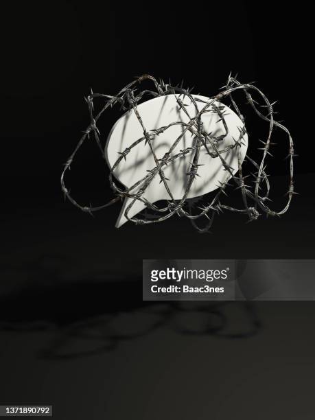 freedom of speech - barbed wire around a speech bubble - press freedom stock pictures, royalty-free photos & images