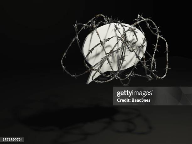 freedom of speech - barbed wire around a speech bubble - press freedom stock pictures, royalty-free photos & images