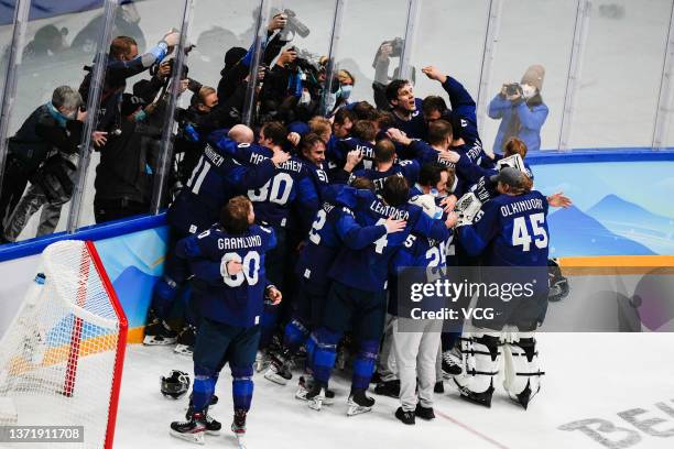 Players of Team Finland celebrate winning the Gold medal at final whistle following the Gold Medal game between Team Finland and Team ROC on Day 16...