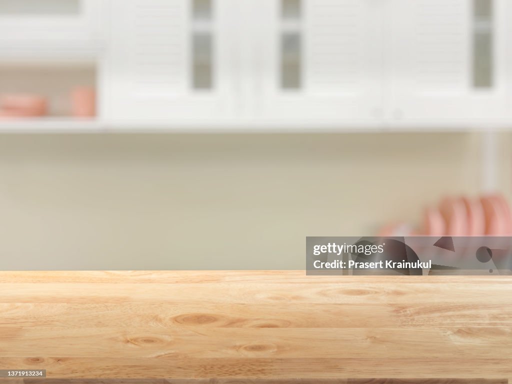 Empty wood tabletop in kitchen. Concept for montage your text or product