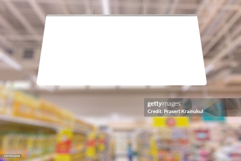 Blank advertising billboard hanging in the supermarket