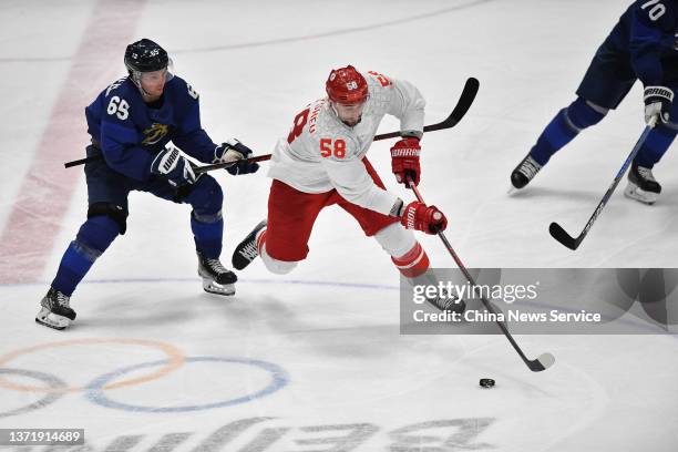 Sakari Manninen of Team Finland and Anton Slepyshev of Team ROC compete during the Gold Medal game between Team Finland and Team ROC on Day 16 of the...