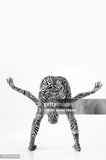 woman in a one-piece bodysuit with a zebra print - stock photo - boygroup stock-fotos und bilder
