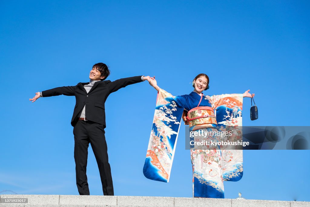 Happy young asian couple and Blue sky