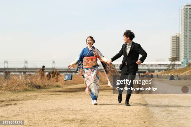 young japanese couple enjoying their youth - seijin no hi stock pictures, royalty-free photos & images