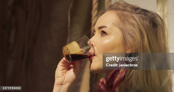 meditative space in desert tent. serene woman enjoying coffee break - smudging ceremony stock pictures, royalty-free photos & images