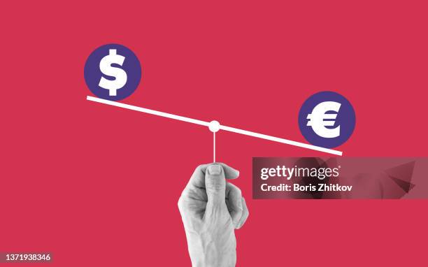 dollar or euro - balance scale stock-fotos und bilder