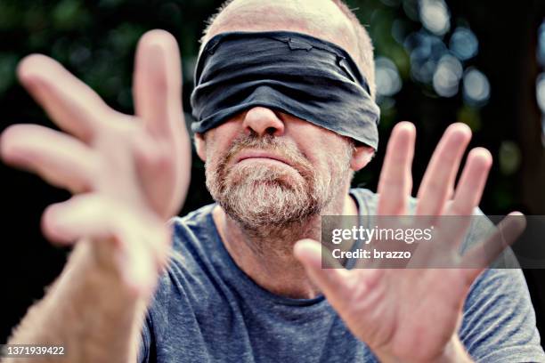 blind fold - blindfold stock pictures, royalty-free photos & images