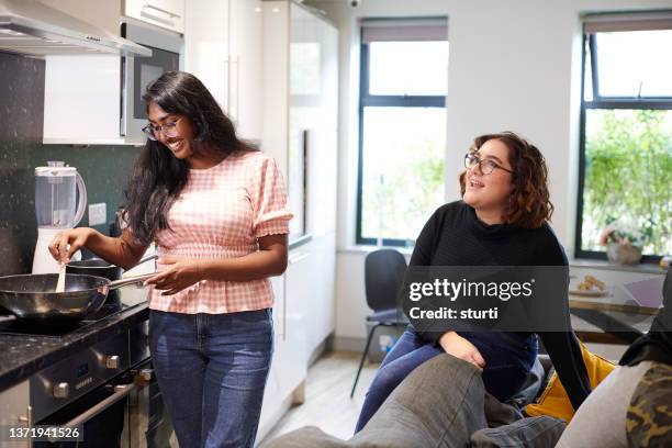 college friends preparing a meal - halls of residence stock pictures, royalty-free photos & images