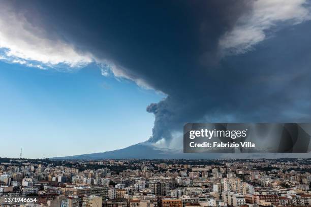 Aerial view of the Etna volcano eruption seen from the city of Catania with a 10 km high ash cloud on February 21, 2022 in Catania, Italy. A new...