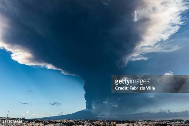 Aerial view of the Etna volcano eruption seen from the city of Catania with a 10 km high ash cloud on February 21, 2022 in Catania, Italy. A new...