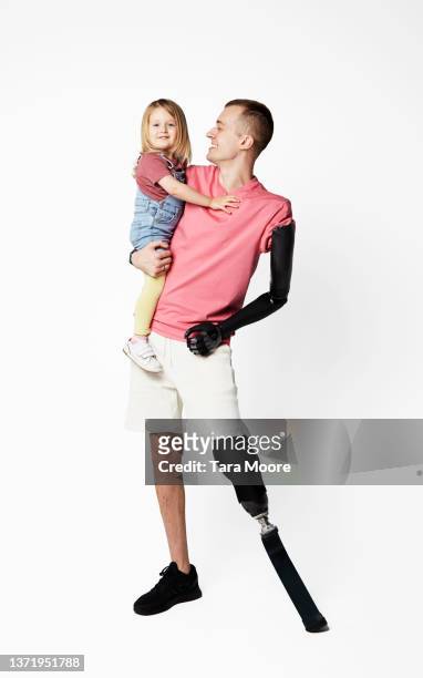 father with disability with young daughter - london not hipster not couple not love not sporty not businessman not businesswoman not young man no stockfoto's en -beelden