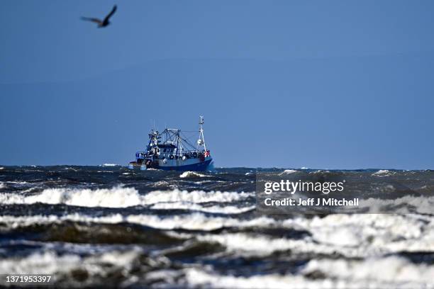 View of a fishing trawler leaving Troon Harbour on February 21, 2022 in Troon, United Kingdom. Storm Franklin, which has prompted flood warnings and...