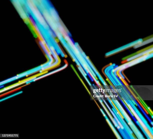 neon traffic intersection - road intersection stock-fotos und bilder