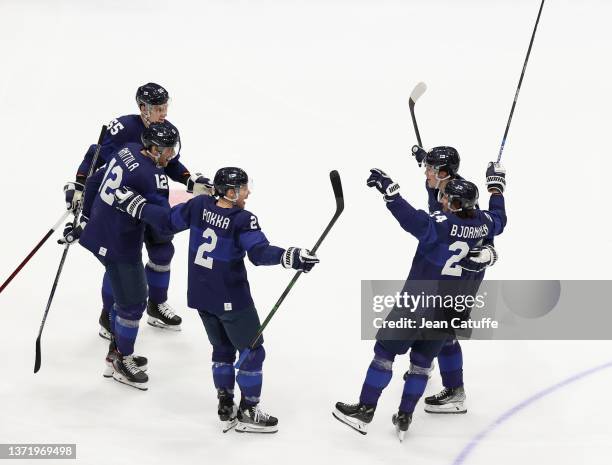 Hannes Bjorninen of Finland celebrates his winning goal with Atte Ohtamaa, Marko Anttila, Ville Pokka during the Gold Medal game between Team Finland...