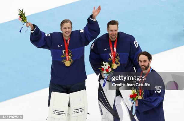 Jussi Olkinuora, Harri Sateri, Frans Tuohimaa of Finland pose with their medals after the 'Medal Cermony' of the Gold Medal game between Team Finland...