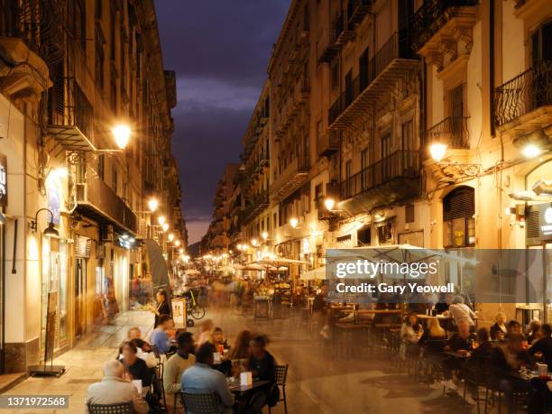 busy street at street at night in palermo - palermo sicilien bildbanksfoton och bilder