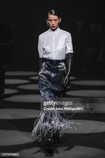 Model walks the runway at the Erdem show during London Fashion Week February 2022 on February 21, 2022 in London, England.