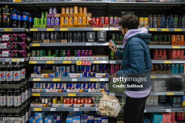 browsing for deals - non alcoholic beverage stock pictures, royalty-free photos & images