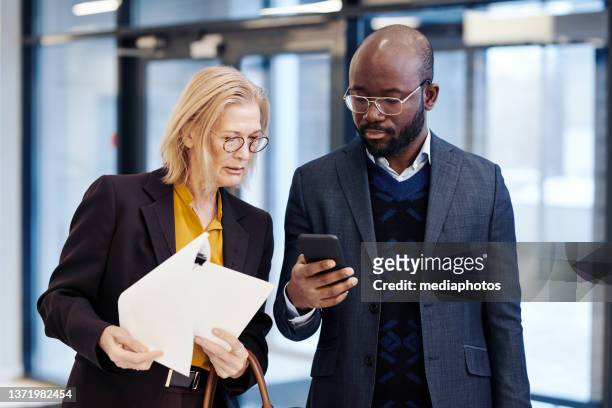 team of lawyers discussing business together - court notice stock pictures, royalty-free photos & images