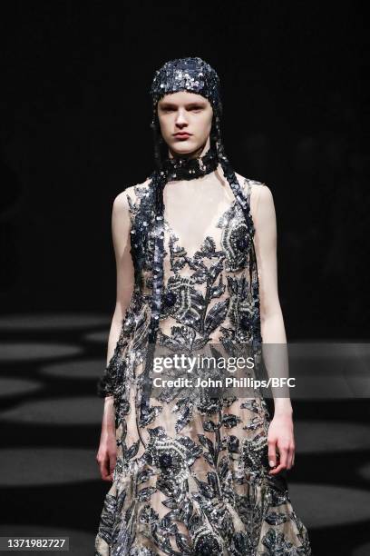 Model walks the runway at the Erdem show during London Fashion Week February 2022 on February 21, 2022 in London, England.