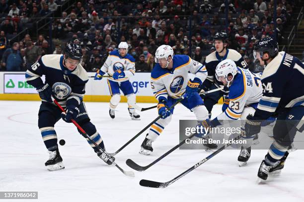 Max Domi of the Columbus Blue Jackets attempts to settle a loose puck during the first period of a game against the Buffalo Sabres at Nationwide...